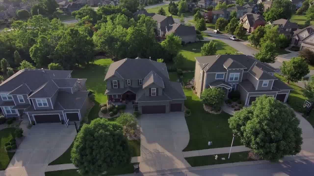Aerial view of glass office towers over a commercial district.